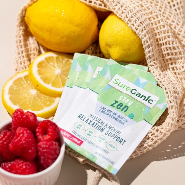 Sureganic Stay Zen packets with fresh fruit